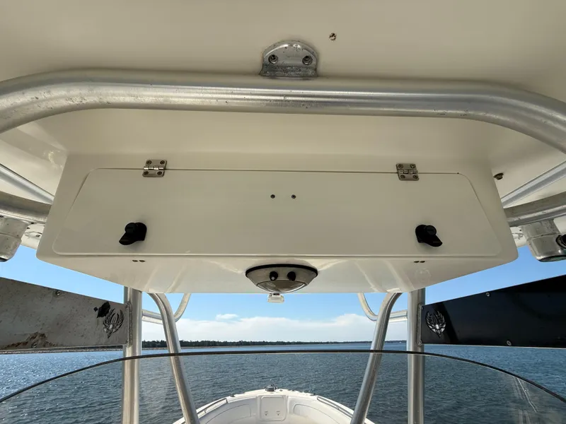 Slide: The Image of 2007 Wellcraft 352 Tournament boat console with storage compartment, viewed from the deck. - 35
