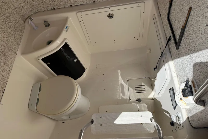 Slide: The Image of 2007 Wellcraft 352 Tournament boat bathroom with toilet and sink. - 36