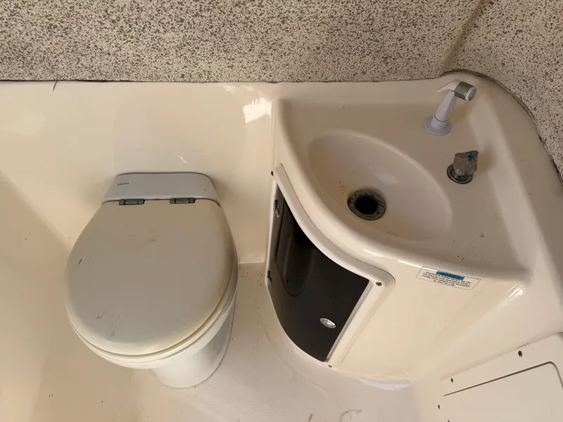 Slide: The Image of 2007 Wellcraft 352 Tournament boat bathroom with toilet and sink. - 37