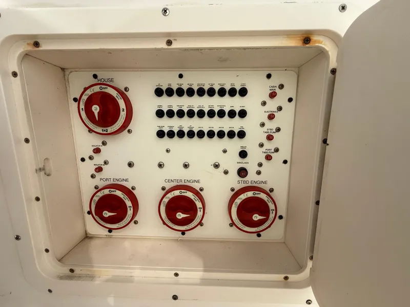 Slide: The Image of Control panel of a 2007 Wellcraft 352 Tournament boat with engine switches and indicators. - 38