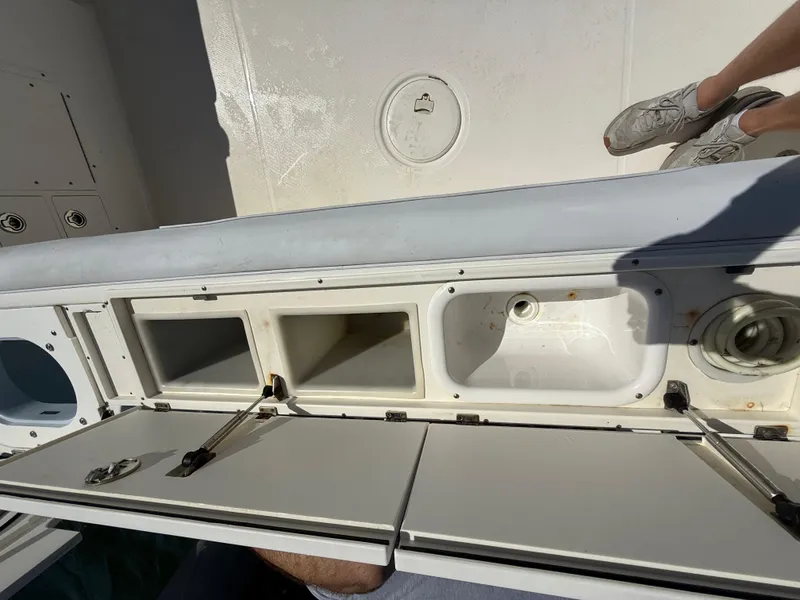 Slide: The Image of 2007 Wellcraft 352 Tournament boat storage compartments with open hatches and visible interior. - 40