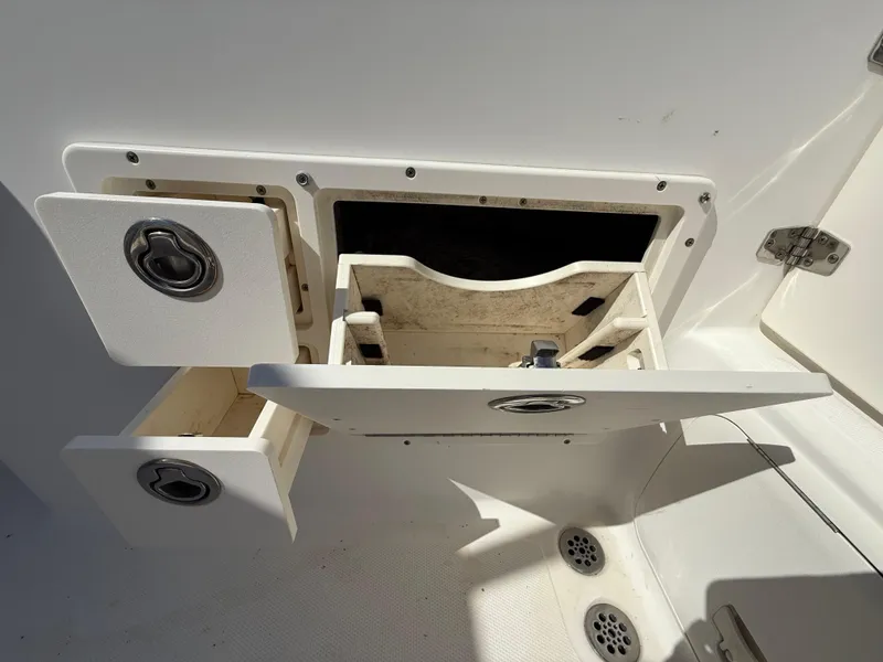 Slide: The Image of Open storage compartments on a 2007 Wellcraft 352 Tournament boat deck. - 42