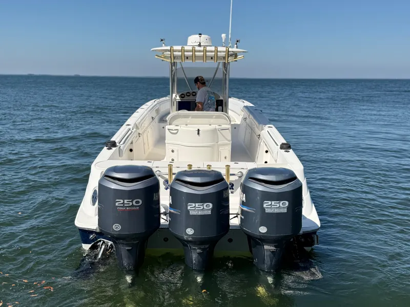 Slide: The Image of 2007 Wellcraft 352 Tournament boat with triple 250 horsepower engines on open water. - 6