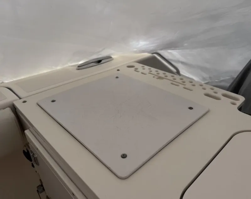 Slide: The Image of 2008 Pursuit C 250 Center Console dashboard with a flat panel and control area. - 13