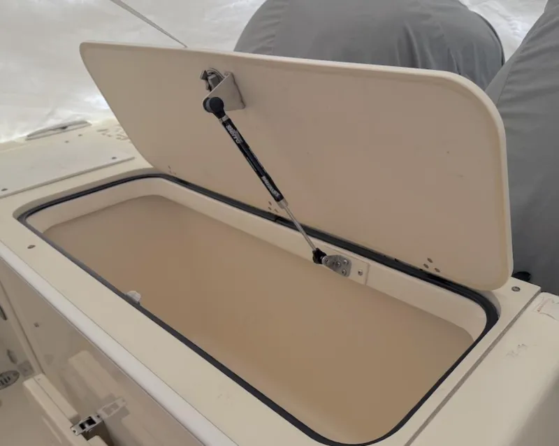Slide: The Image of Open storage compartment on 2008 Pursuit C 250 Center Console boat. - 14