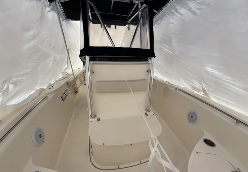 Slide: The Image of 2008 Pursuit C 250 Center Console boat interior under protective cover. - 17