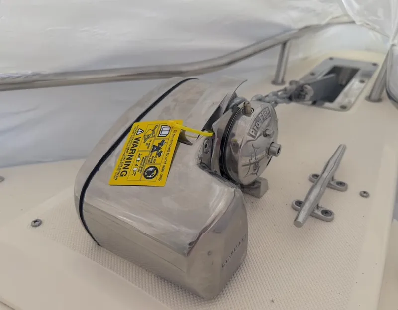 Slide: The Image of 2008 Pursuit C 250 Center Console boat with anchor winch and warning tag. - 21