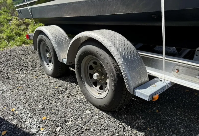 Slide: The Image of Trailer for 2008 Pursuit C 250 Center Console on gravel. - 32