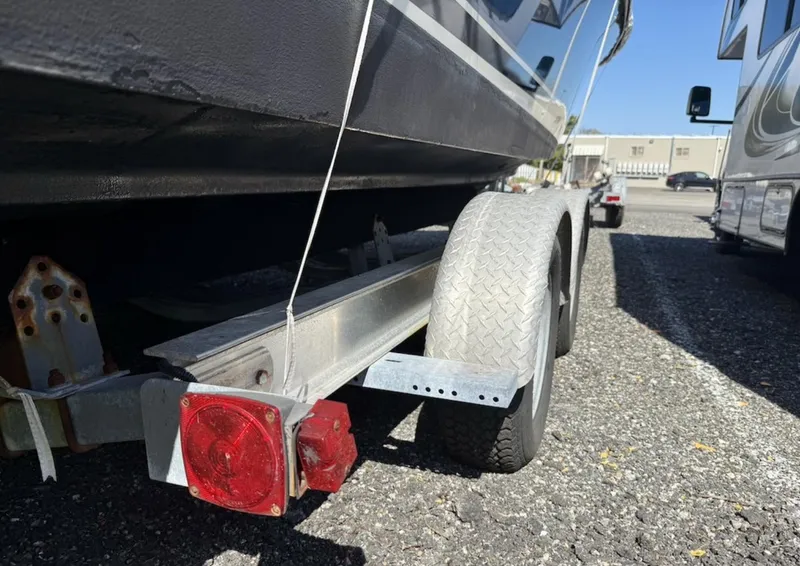 Slide: The Image of 2008 Pursuit C 250 Center Console boat on trailer, rear view, parked outdoors. - 33