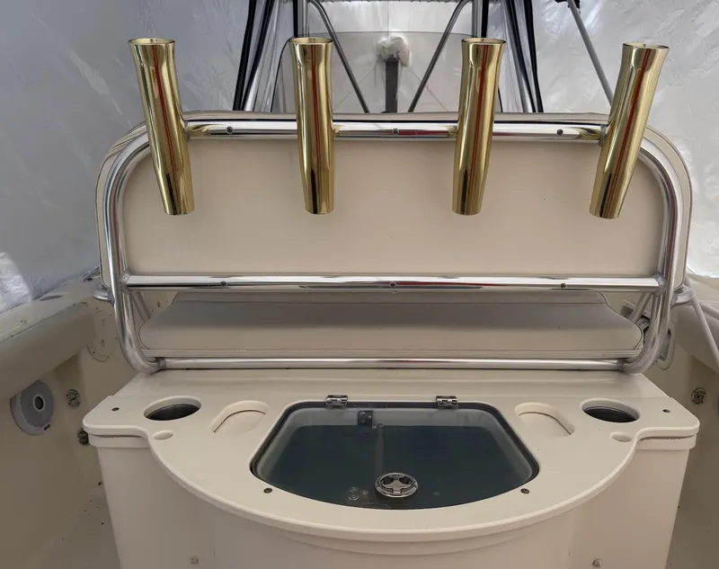 Slide: The Image of 2008 Pursuit C 250 Center Console boat with rod holders and livewell. - 5