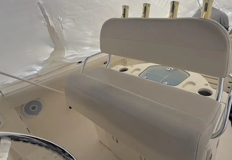 Slide: The Image of 2008 Pursuit C 250 Center Console boat interior with seating and rod holders. - 7