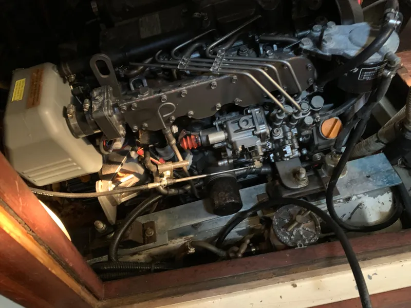 Slide: The Image of Engine compartment of a 1978 Camper & Nicholsons Sloop, showcasing detailed mechanical components. - 10