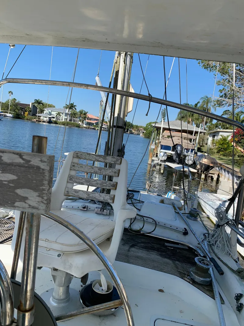 Slide: The Image of 1978 Camper & Nicholsons Sloop docked by a scenic waterfront with clear blue skies. - 16