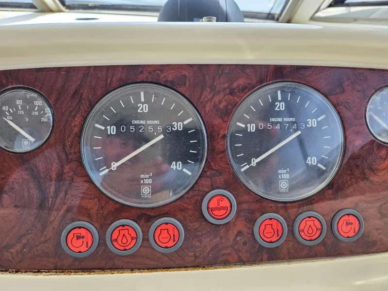 Slide: The Image of Instrument panel of 1998 Viking Princess 46 Flybridge Sport Cruiser with engine hour gauges. - 12