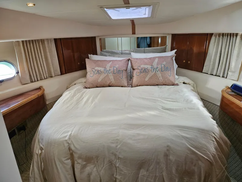 Slide: The Image of Luxurious bedroom in 1998 Viking Princess 46 Flybridge Sport Cruiser yacht. - 16