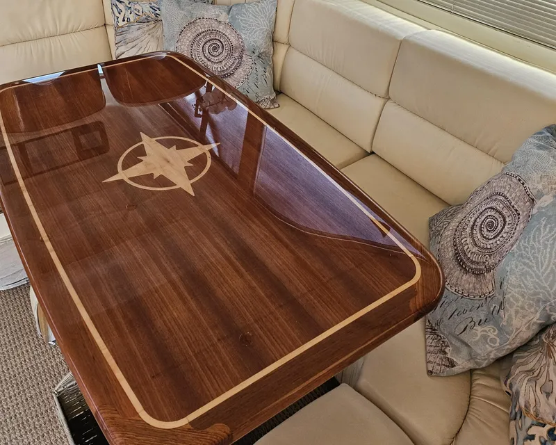 Slide: The Image of Luxurious interior of 1998 Viking Princess 46 Flybridge Sport Cruiser with elegant wooden table. - 21