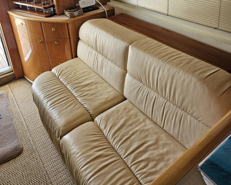 Slide: The Image of Luxurious leather sofa in 1998 Viking Princess 46 Flybridge Sport Cruiser interior. - 23