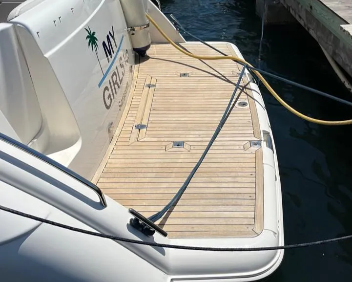 Slide: The Image of 1998 Viking Princess 46 Flybridge Sport Cruiser, teak swim platform, docked at marina. - 28