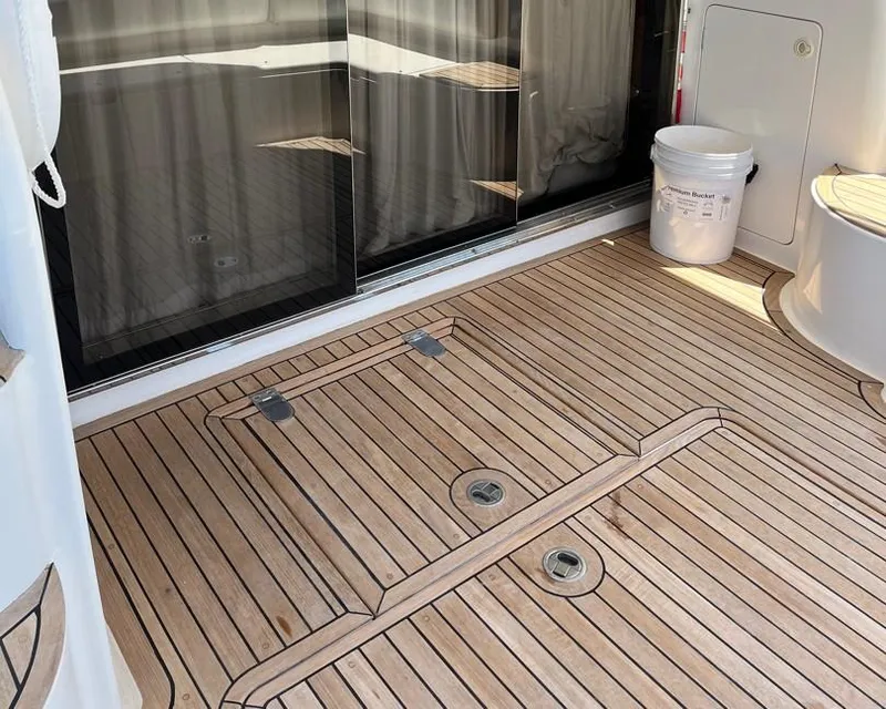 Slide: The Image of Teak deck of 1998 Viking Princess 46 Flybridge Sport Cruiser with bucket and sliding glass door. - 29