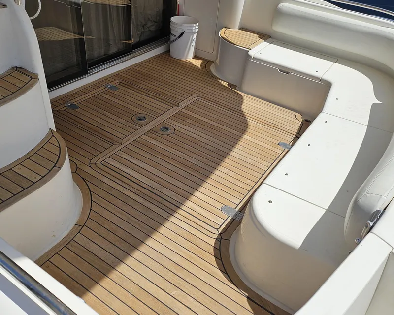 Slide: The Image of 1998 Viking Princess 46 Flybridge Sport Cruiser with teak deck and white seating. - 30