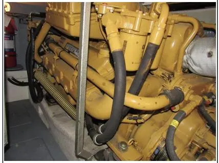 Slide: The Image of Engine room of 1998 Viking Princess 46 Flybridge Sport Cruiser, showcasing detailed machinery components. - 34