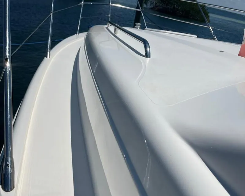 Slide: The Image of 1998 Viking Princess 46 Flybridge Sport Cruiser deck with railing, ocean view. - 8