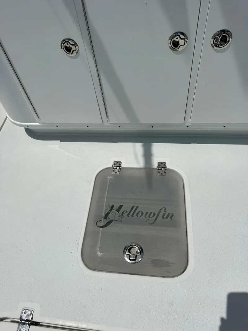 Slide: The Image of 2020 Yellowfin 39 Offshore boat deck with storage hatch and logo. - 11
