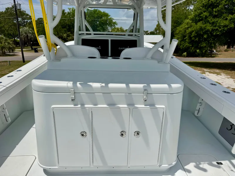 Slide: The Image of 2020 Yellowfin 39 Offshore boat interior with seating and storage compartments. - 14