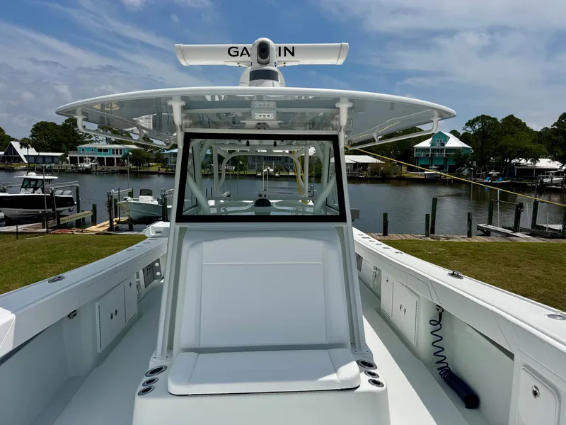 Slide: The Image of 2020 Yellowfin 39 Offshore boat docked by a scenic waterfront. - 19