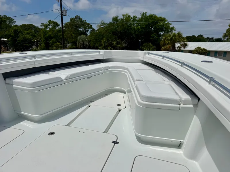 Slide: The Image of 2020 Yellowfin 39 Offshore boat with spacious white seating area. - 29