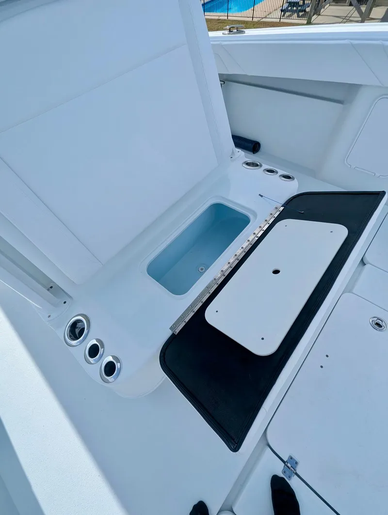Slide: The Image of 2020 Yellowfin 39 Offshore boat interior with storage compartments and rod holders. - 34