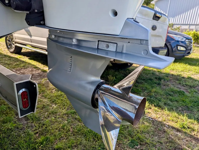 Slide: The Image of 2020 Yellowfin 39 Offshore boat propeller and motor detail, parked on grass. - 42