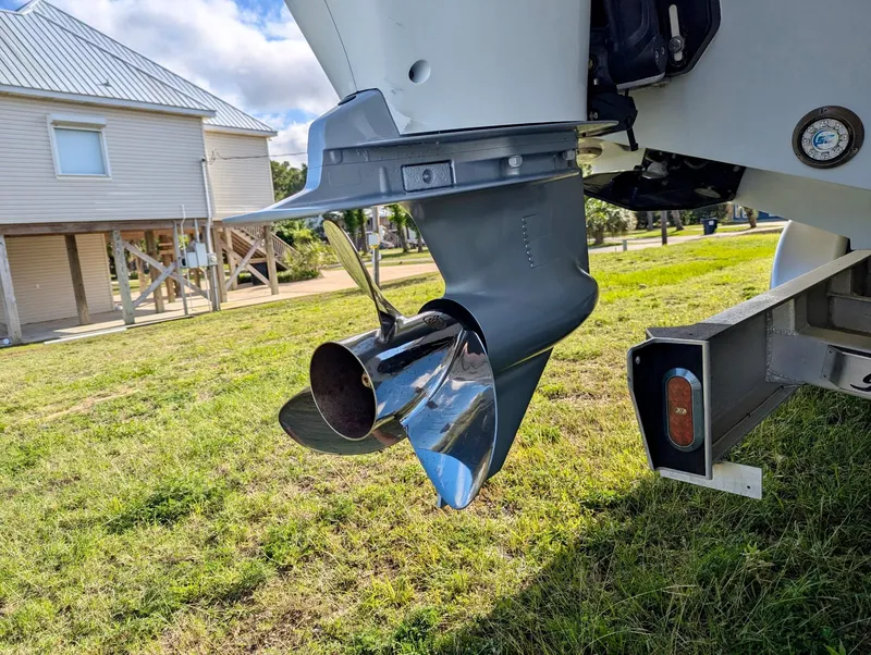 Slide: The Image of 2020 Yellowfin 39 Offshore boat propeller on grassy area near stilt house. - 43