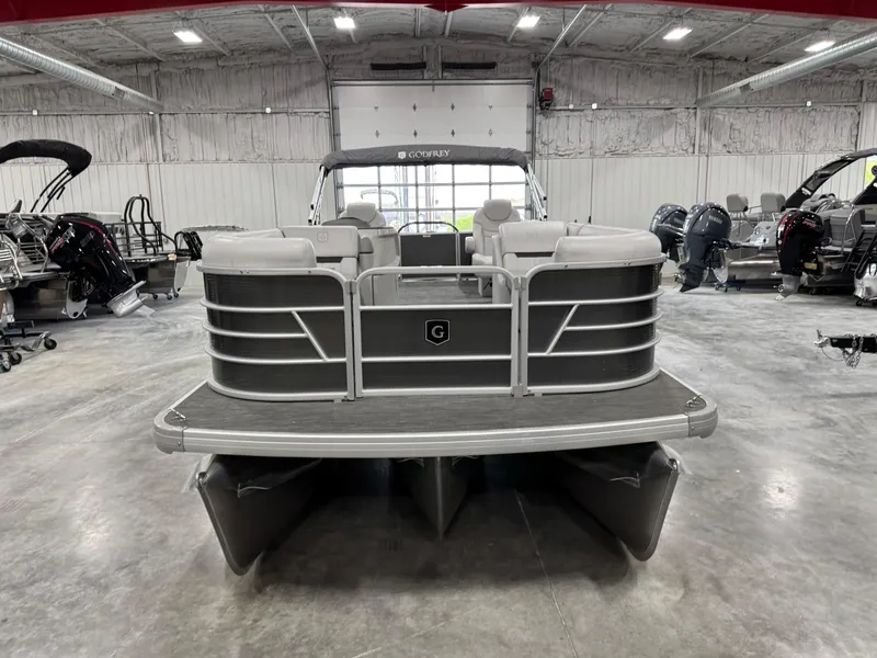 Slide: The Image of 2023 Sweetwater 2286 pontoon boat in a showroom, front view. - 5