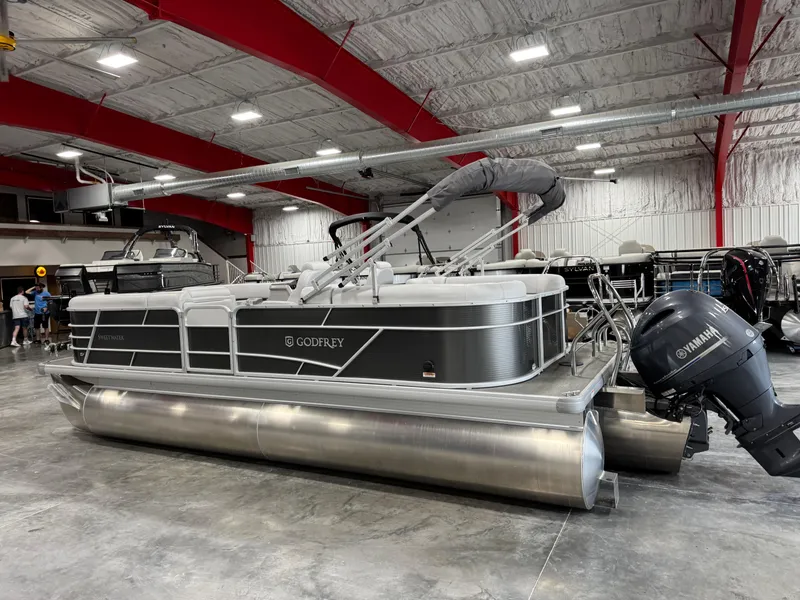 Slide: The Image of 2023 Sweetwater 2286 pontoon boat with Yamaha engine in a showroom. - 6