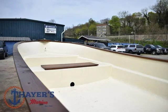 Slide: The Image of 1980 Carolina Skiff boat at Thayer's Marine dealership, outdoor view. - 11