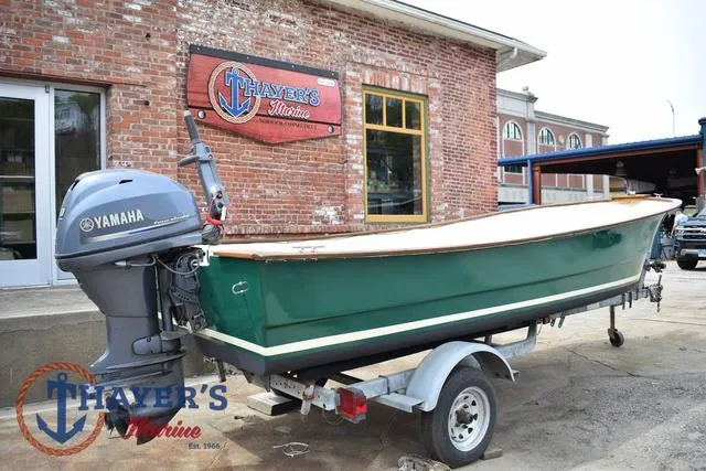 Slide: The Image of 1980 Carolina Skiff boat with Yamaha motor on trailer, parked outside Thayer's Marine. - 4