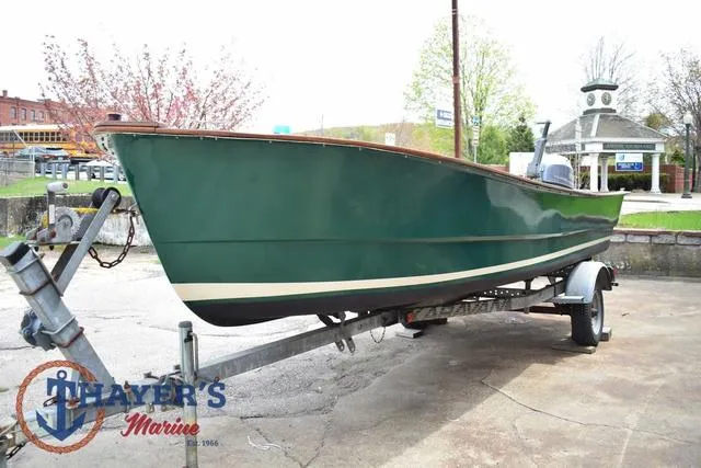 Slide: The Image of Green 1980 Carolina Skiff boat on trailer at Thayer's Marine. - 5