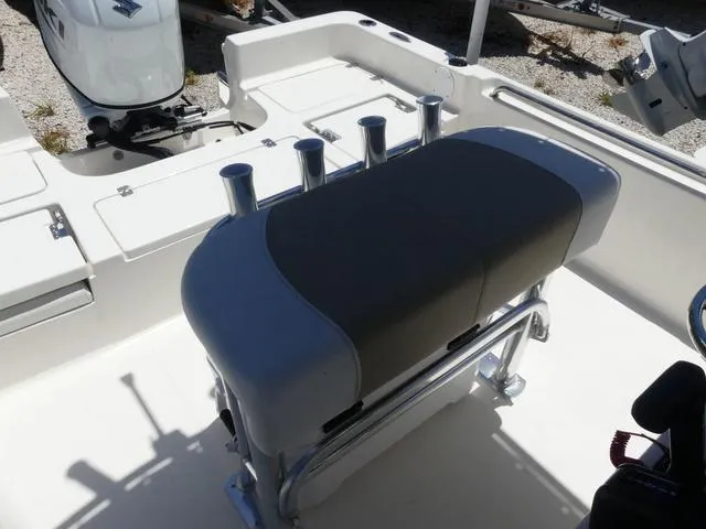 Slide: The Image of 2025 Bulls Bay 2200XS boat interior with seating and rod holders. - 13