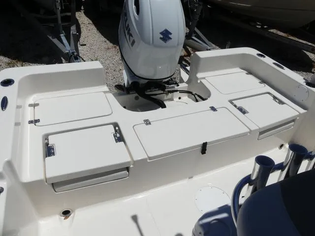 Slide: The Image of 2025 Bulls Bay 2200XS boat with Suzuki outboard motor, featuring spacious deck and storage compartments. - 14