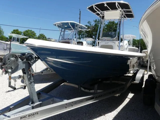 Slide: The Image of 2025 Bulls Bay 2200XS boat on trailer, blue hull, parked outdoors. - 3