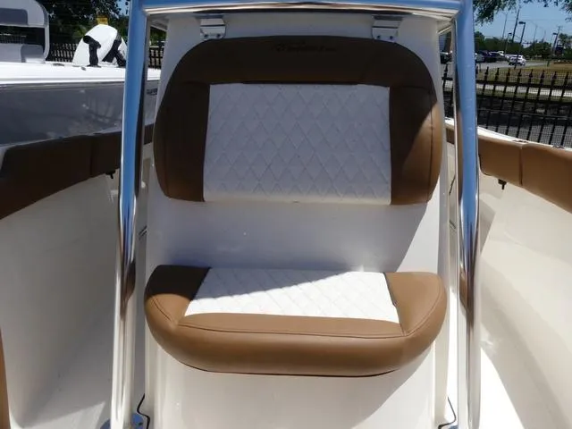 Slide: The Image of 2025 Pioneer ISLANDER 202 boat seat with brown and white upholstery. - 11