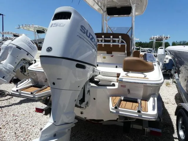 Slide: The Image of 2025 Pioneer ISLANDER 202 boat with Suzuki 150 outboard motor, displayed outdoors. - 4