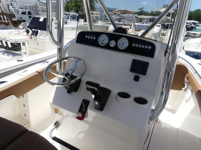 Slide: The Image of 2025 Pioneer ISLANDER 202 boat dashboard with steering wheel and controls. - 5