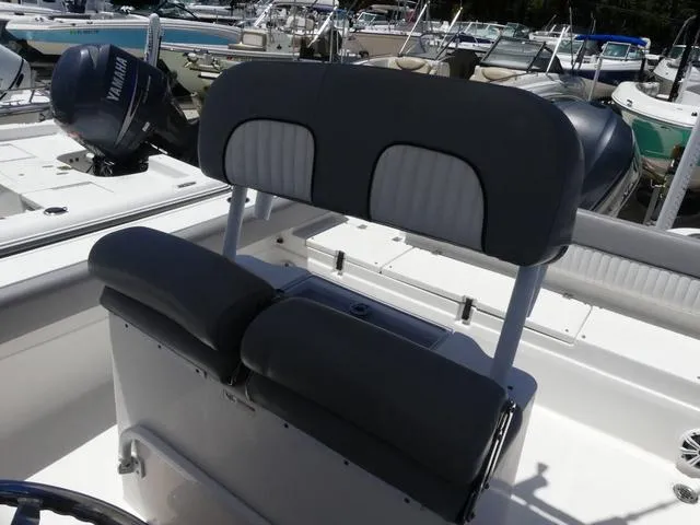 Slide: The Image of 2017 Sea Fox 246 Commander boat interior with Yamaha engine, featuring cushioned seating. - 11