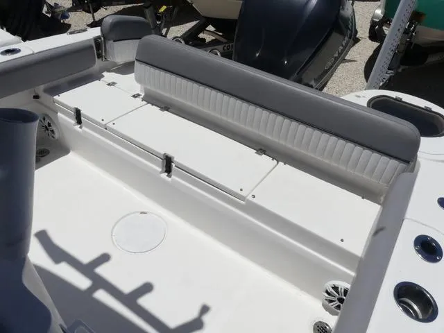 Slide: The Image of 2017 Sea Fox 246 Commander boat interior with cushioned seating and storage compartments. - 12