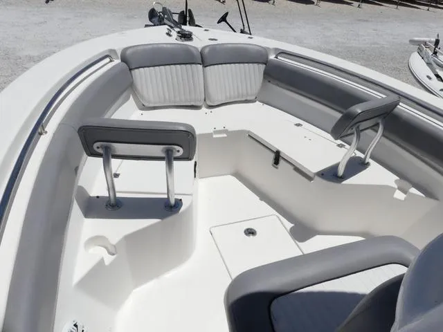 Slide: The Image of 2017 Sea Fox 246 Commander boat interior with gray seating and storage compartments. - 14