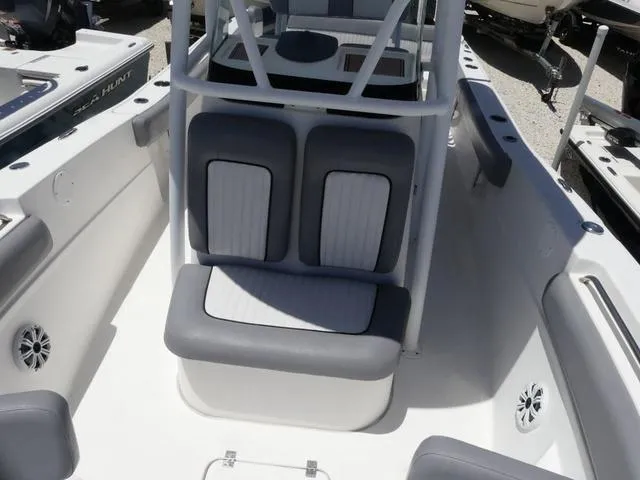 Slide: The Image of 2017 Sea Fox 246 Commander boat interior with cushioned seating and storage. - 15