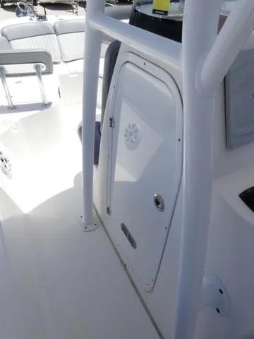Slide: The Image of 2017 Sea Fox 246 Commander boat interior with white console and seating. - 17