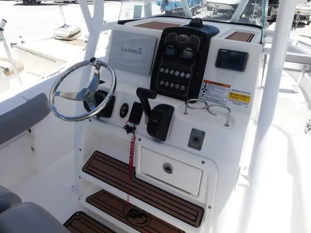 Slide: The Image of 2017 Sea Fox 246 Commander boat console with Garmin navigation system and steering wheel. - 8
